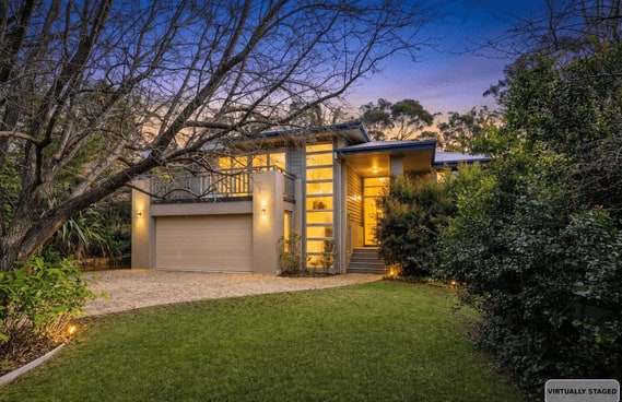 Front of 4 Farnham Ave at dusk with a garage, lit entrance, lawn and trees; source photograph is labelled virtually staged
