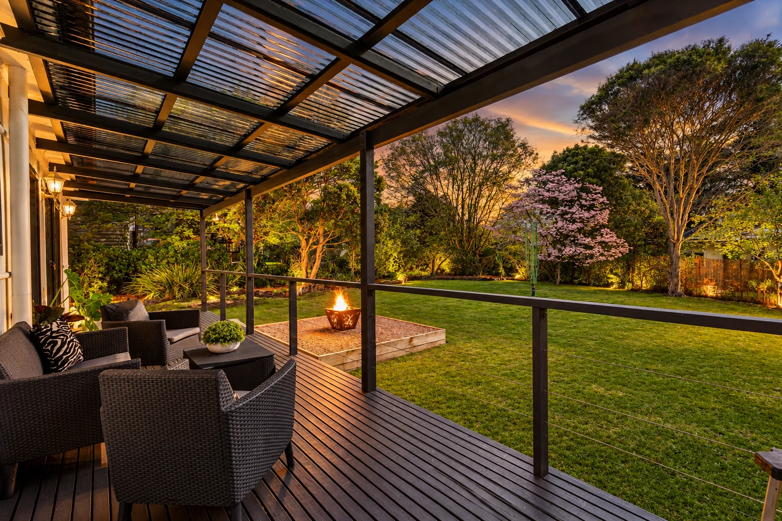 Covered outdoor entertaining area overlooking the lawn and established gardens.